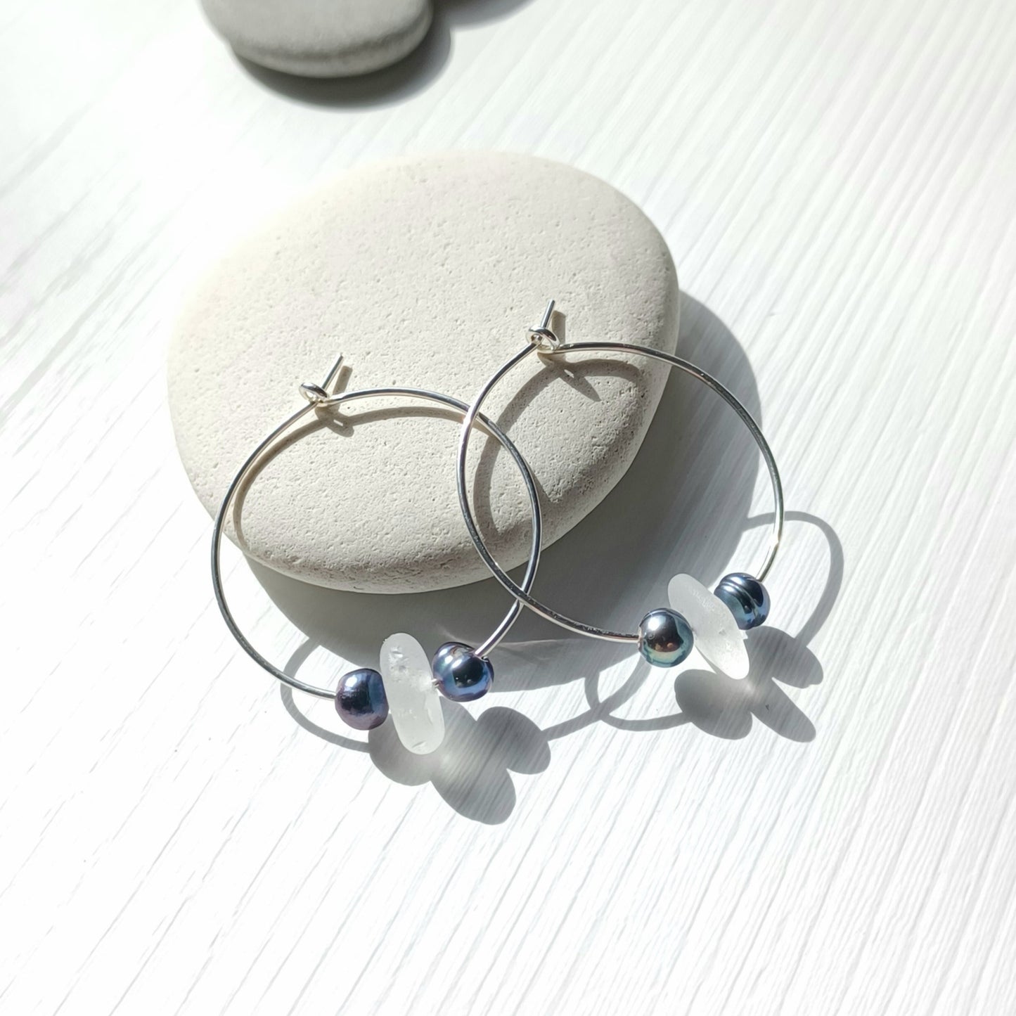 Silver hoops with peacock pearls and white sea glass.