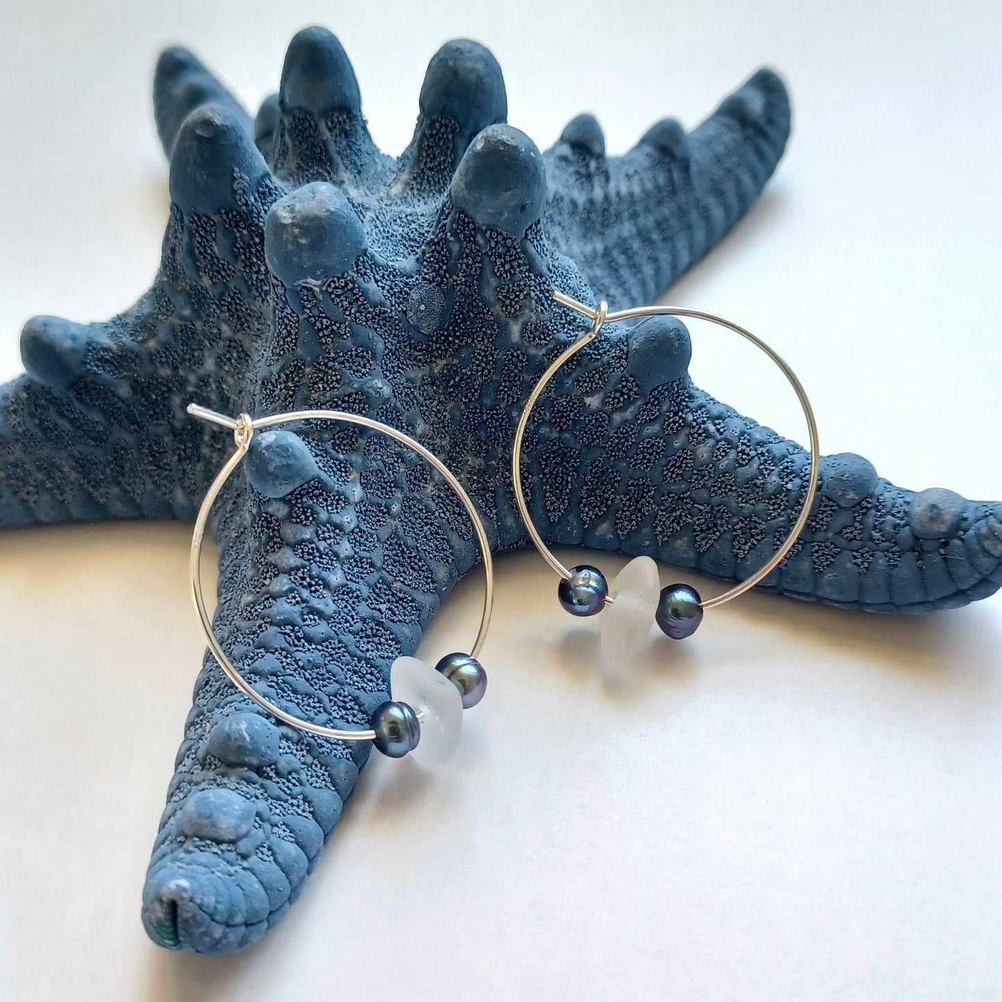 Silver hoops with peacock pearls and white sea glass.