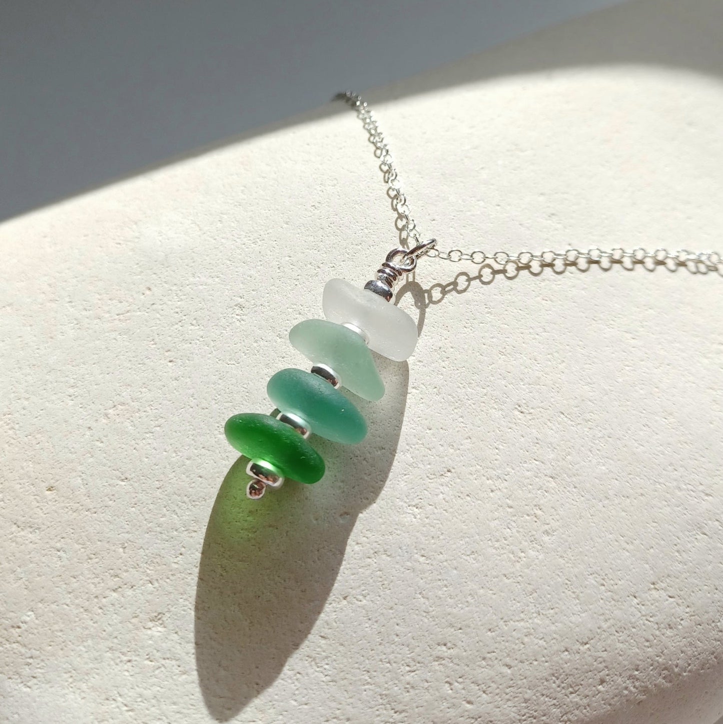 Silver and sea glass stack necklace in coastal colours.