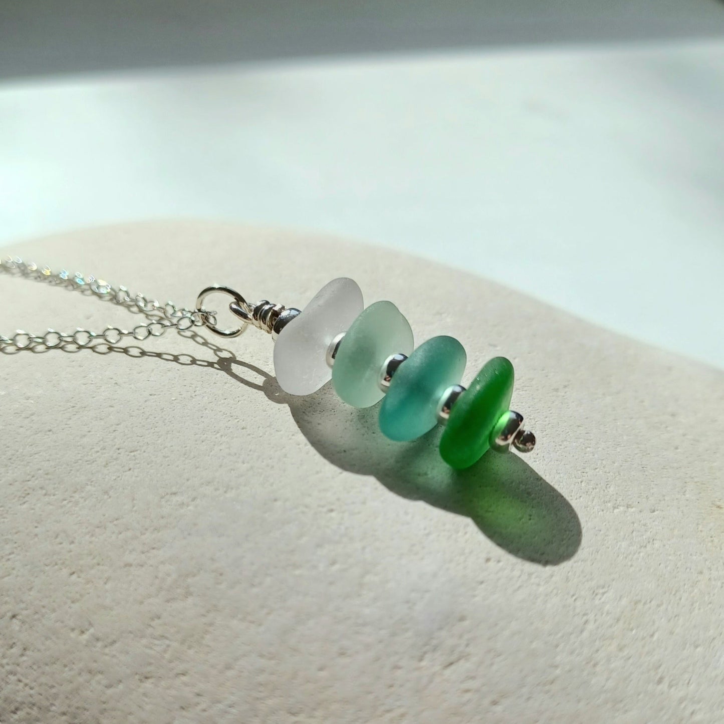 Silver and sea glass stack necklace in coastal colours.