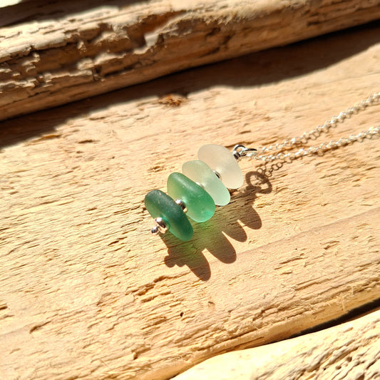 Silver necklace with a pendant made with 4 pieces of sea glass in coastal shades, made in Cyprus.