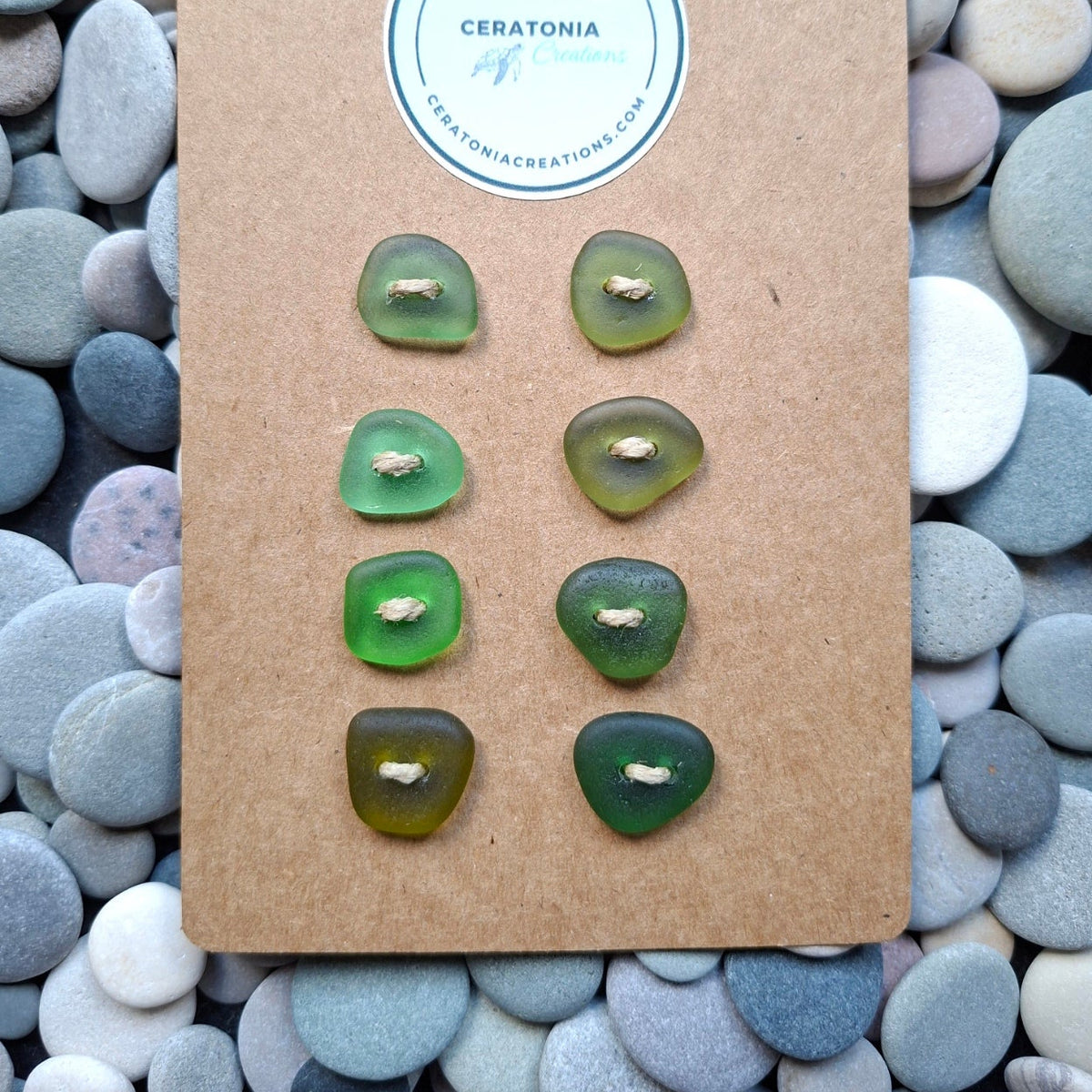 Sea glass buttons in various shades of coastal green.